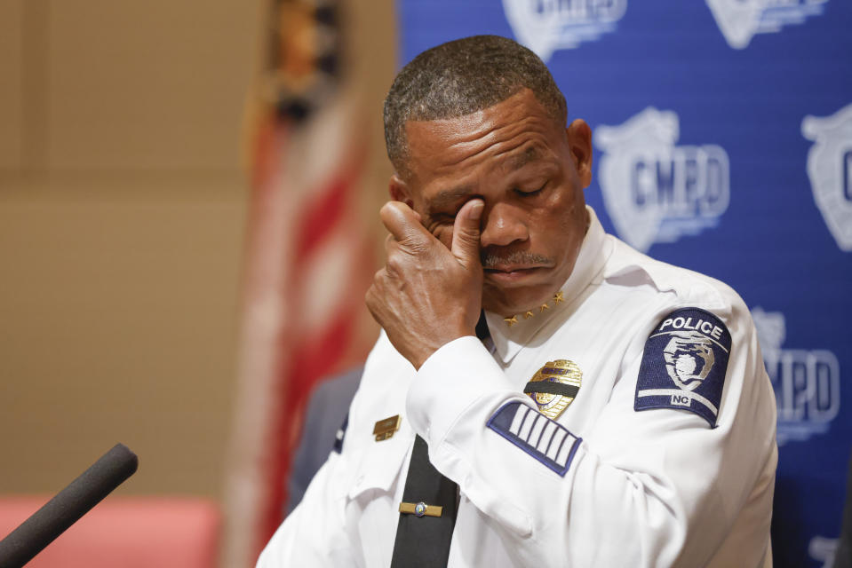 Charlotte-Mecklenburg Police Chief Johnny Jennings wipes away tears as he speaks at a press conference in Charlotte, N.C., Tuesday, April 30, 2024, regarding the shooting that killed four officers during an attempt to serve a warrant on April 29. (AP Photo/Nell Redmond)