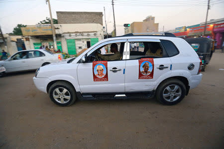 Pictures of Sudanese President Omar al-Bashir and head of Rapid Support Forces Mohammed Hamdan Dagolo are seen on a car, during Sudanese President Omar al-Bashir visit to the war-torn Darfur region, in Nyala, Darfur, Sudan September 19, 2017. REUTERS/Mohamed Nureldin Abdallah