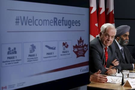 Canada's Immigration Minister John McCallum (L) and Defence Minister Harjit Sajjan attend a news conference in Ottawa, Canada November 24, 2015. REUTERS/Chris Wattie