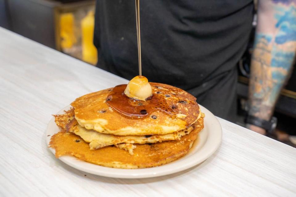 Mattie’s Diner blueberry pancakes with syrup poured on top.