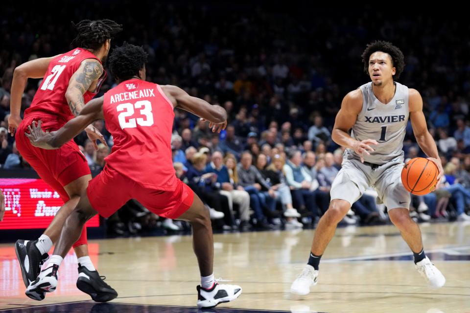 Desmond Claude scored 14 points and made a pair of free throws to give Xavier  a 52-51 lead with 6:56 remaining, but Houston held the Musketeers scoreless for the next five minutes.