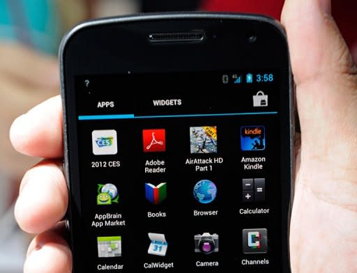 The Galaxy Nexus smarthphone is displayed at the Samsung booth at the 2012 International Consumer Electronics Show in Las Vegas. Google's Android system has grabbed more than 50 percent of the US smartphone market, while Samsung cemented its leadership as the top device maker, a survey showed Tuesday