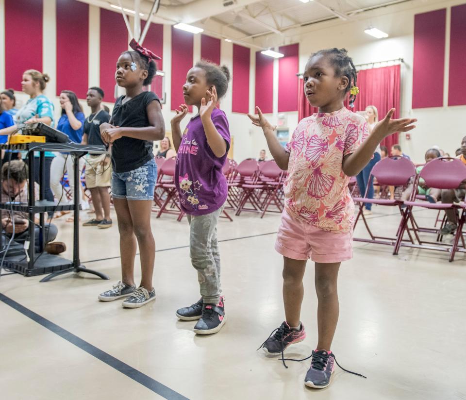 From right, Jada Gregory, Saniya Kirkland, and Hermoneii Grandison dance during the Performing Arts Night at the Woodland Heights Neighborhood Resource Center in Pensacola on Wednesday, September 18, 2019. City officials plan to use a $1.7 million grant from the Escambia Children's Trust to host more art and culture activities at the center.