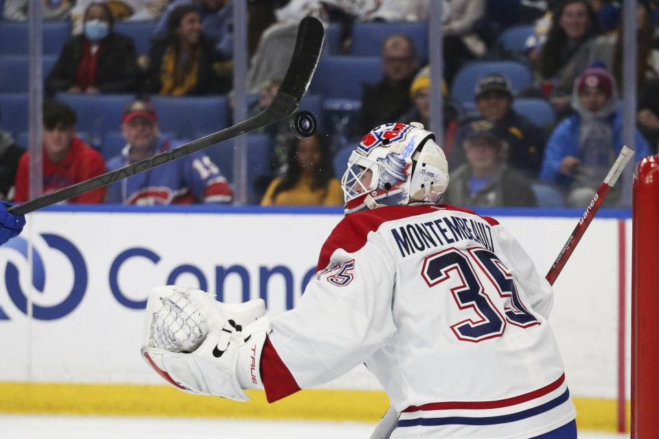 Montreal Canadiens goaltender Sam Montembeault (35) watches the puck after blocking a shot during the second period of an NHL hockey game against the Buffalo Sabres, Friday, Nov. 26, 2021, in Buffalo, N.Y. (AP Photo/Joshua Bessex)