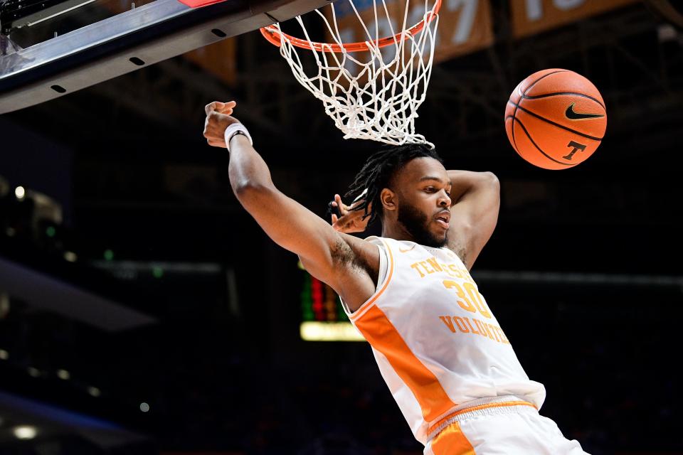 Tennessee guard Josiah-Jordan James (30) dunks the ball during a game at Thompson-Boling Arena in Knoxville, Tenn. on Wednesday, Jan. 26, 2022.