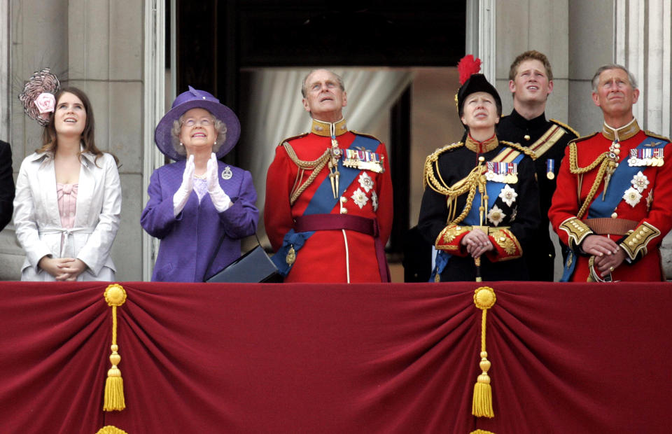 Britain's Queen Elizabeth (2nd L), her husband Philip, the Duke of Edinburgh (3rd L), Princess Anne (3rd R), Prince Harry (2nd R) and Prince Charles (R) watch a flypast of aircraft from the balcony at Buckingham Palace in central London June 17, 2006. Thousands of tourists and Londoners waited in soaring temperatures on Saturday to watch the Queen as she attended the annual Trooping the Colour ceremony this year to mark her 80th birthday.  REUTERS/Stringer  (BRITAIN)