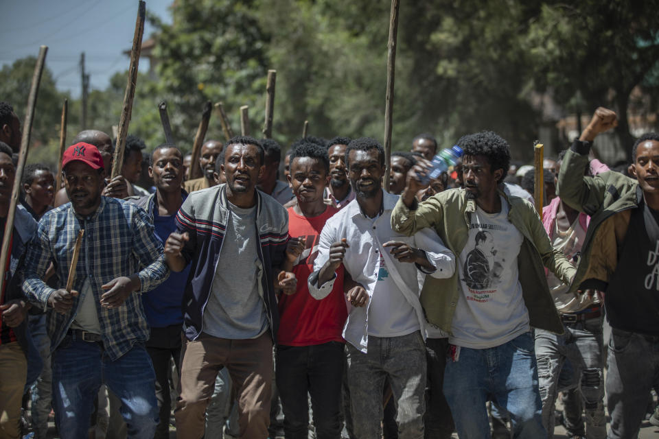 A group of supporters perform and shout slogans at the house of opposition leader Jawar Mohammed to show their support, in Addis Ababa, Ethiopia, Thursday Oct. 24, 2019. Ethiopia’s Nobel Peace Prize-winning prime minister Abiy Ahmed faced the most serious political challenge of his short rule Thursday as officials said dozens of people might be dead in two days of unrest, and Jawar Mohammed hinted that he might enter next year’s election race to challenge Abiy to become Prime Minister. (AP photo Mulugeta Ayene)