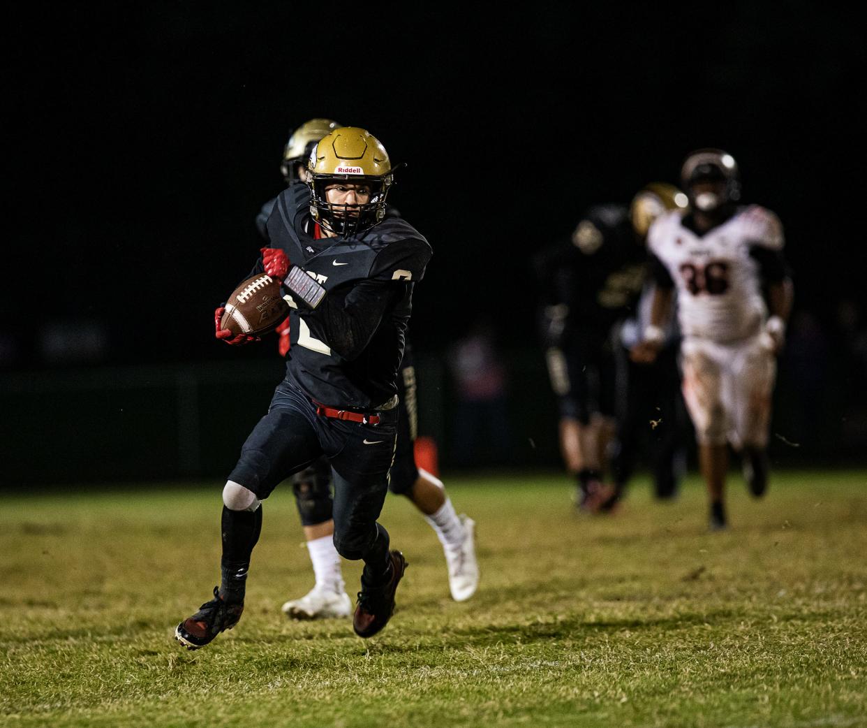 Bullitt East wide receiver Camron Brogan (2) turned upfield against the Fern Creek defense on Friday night. The Chargers defeated the visiting Tigers, 20-6. Oct. 8, 2021
