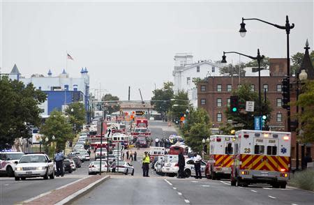 Police block off M Street, SE as they respond to a shooting at the Washington Navy Yard, in Washington September 16, 2013. REUTERS/Joshua Roberts