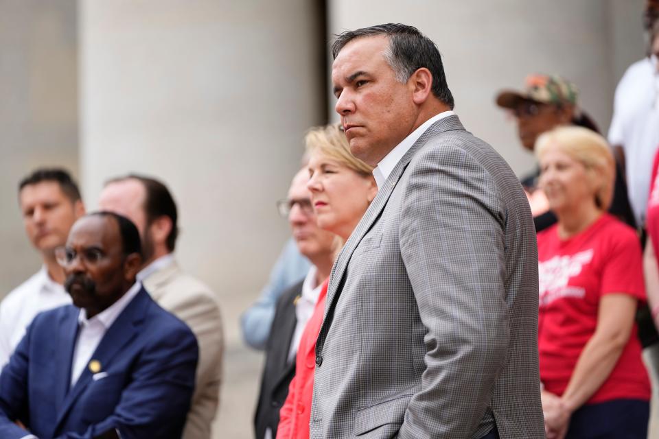 Jul 27, 2023; Columbus, Ohio, USA;  Mayor Andrew Ginther stands with local and state leaders during a press conference with city and state officials demanding gun control reforms on the steps of the Ohio Statehouse.