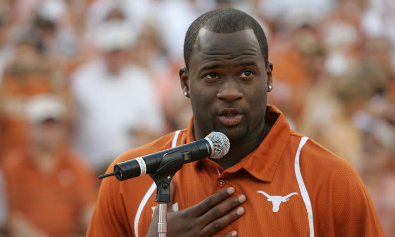 Vince Young speaking into a microphone during a Texas Longhorns game.