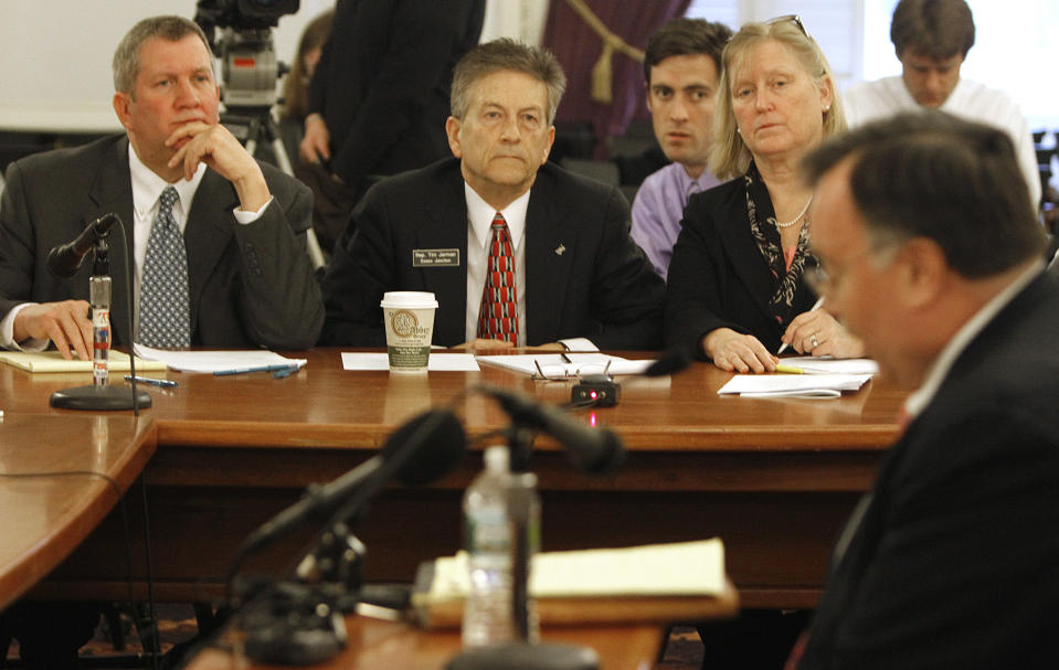 Lawmakers from left, Rep. Kurt Wright, R-Burlington, Rep. Tim Jerman, D-Essex Junction, and Rep Sarah Edwards, D-Brattleboro, listen to testimony from Larry Reilly, CEO of CVPS, right, on Tuesday, April 10, 2012 in Montpelier, Vt. Representatives of Vermont's largest electric utility testified before a legislative committee about a deal to sell the utility to the state's second largest utility, a subsidiary of Montreal-based GazMetro. (AP Photo/Toby Talbot)