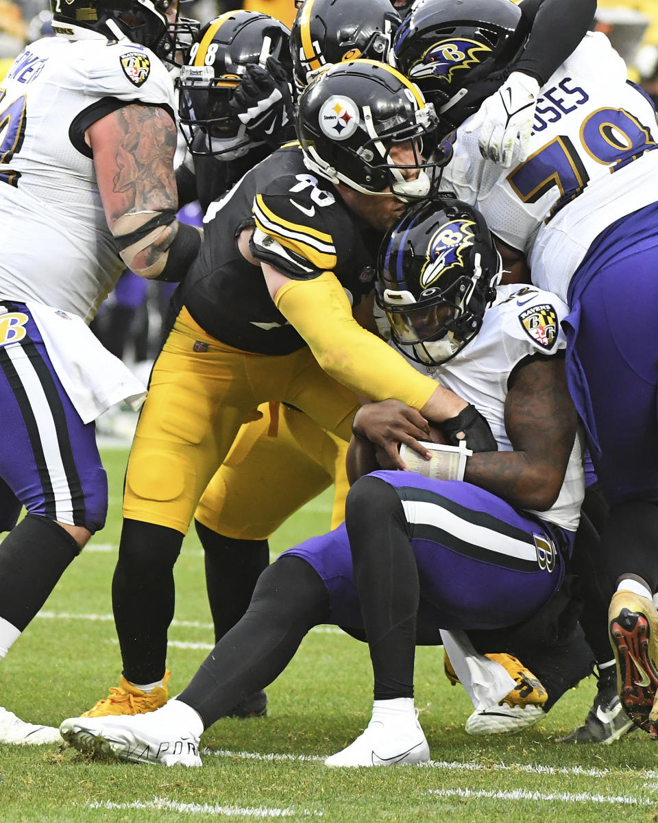 Baltimore Ravens quarterback Anthony Brown is sacked by Pittsburgh Steelers linebacker T.J. Watt during the second half of an NFL football game in Pittsburgh, Sunday, Dec. 11, 2022. (AP Photo/Fred Vuich)