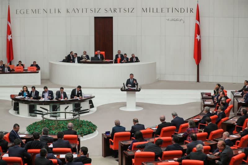 Turkish lawmakers vote a bill that allows troop deployment to Libya, at the Parliament in Ankara