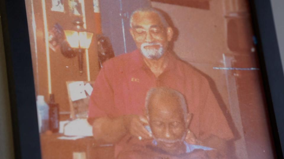 A photo of Elise Campbell, the barbering mentor of Marvin Taylor, hangs in Taylor's barbershop, All in the Wrists, located at 11 W 22nd Street, on Thursday, Nov. 9, 2023, in the Meridian Highland neighborhood in Indianapolis.