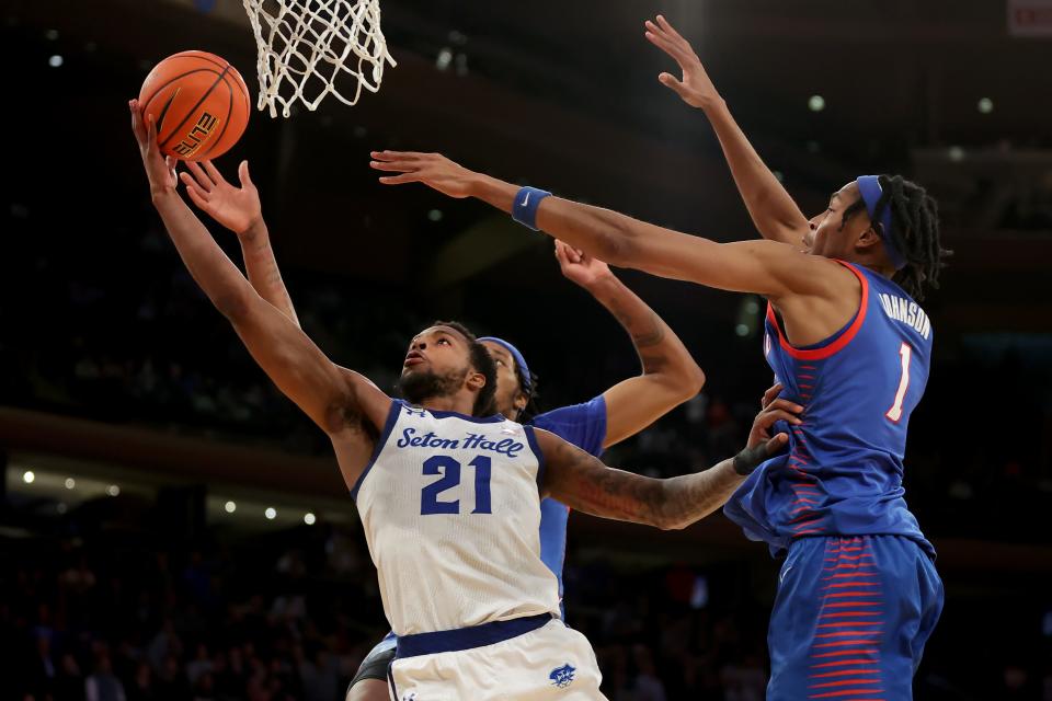 DePaul Blue Demons center Nick Ongenda (14) blocks a shot at the buzzer by Seton Hall Pirates guard Femi Odukale (21) during the second half at Madison Square Garden.