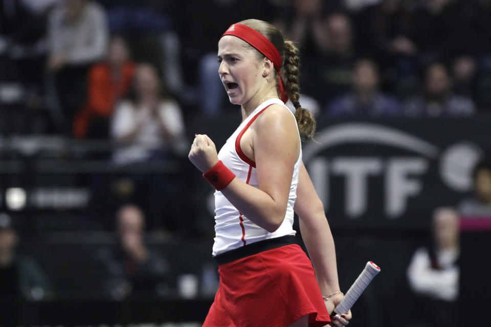 Latvia's Jelena Ostapenko reacts after winning a crucial point against United States' Sofia Kenin during a Fed Cup qualifying tennis match Saturday, Feb. 8, 2020, in Everett, Wash. (AP Photo/Elaine Thompson)