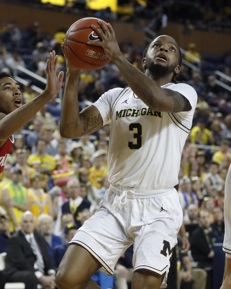 Michigan guard Zavier Simpson makes a layup during the second half of the team's NCAA college basketball game against Indiana, Sunday, Feb. 16, 2020, in Ann Arbor, Mich. (AP Photo/Carlos Osorio)