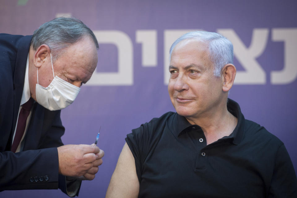 Israeli Prime Minister Minister Benjamin Netanyahu is ready to receive the second COVID-19 vaccine at Sheba Medical Center in Ramat Gan, Israel, on Saturday, Jan. 9, 2021. (Miriam Elster /Pool Photo via AP)