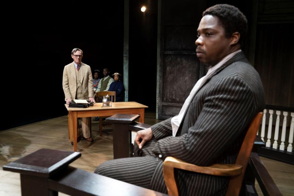 Tom Robinson, right, played by Yaegel T. Welch, is questioned on the stand by Atticus Finch, played by Richard Thomas, in "To Kill a Mockingbird."