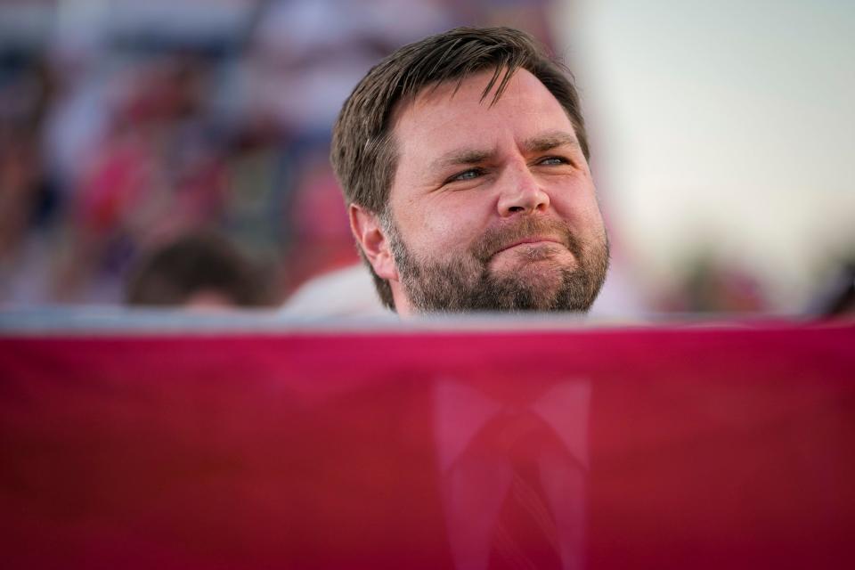 Apr 23, 2022; Delaware, Ohio, USA; Republican U.S. Senate candidate J.D. Vance listens to former President Donald Trump speak during a rally at the Delaware County Fairgrounds. Mandatory Credit: Adam Cairns-The Columbus Dispatch