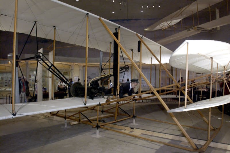 The original 1903 Wright Flyer is displayed for the first time at eye level since the Smithsonian acquired it in 1948, on December 17, 2003, in Washington, D.C. On December 17, 1903, Orville Wright made history's first sustained airplane flight, lasting 12 seconds and covering 120 feet near Kitty Hawk, N.C. His brother Wilbur flew 852 feet later that day. File Photo by Michael Kleinfeld/UPI