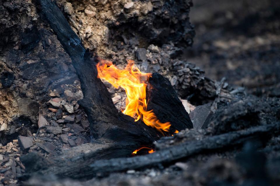 A small fire smolders at the Little Valley Mountain Resort in the Wears Valley area on Thursday, March 31, 2022.