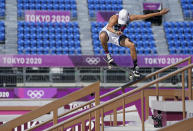 FILE - In this July 25, 2021, file photo, Jagger Eaton, of the United States, competes in men's street Skateboarding during the Tokyo Olympics in Tokyo, Japan. In arenas across Tokyo, athletes accustomed to feeding off the deafening roar of the crowd are searching for new ways to feel Olympic enthusiasm. Eaton found mood booster in the phone he occasionally fished out of his right pocket while competing to change the music. (Nathan Denette/The Canadian Press via AP, File)