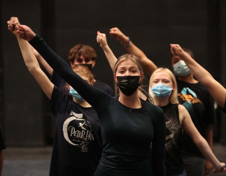 Hudson High graduate Megan Archer portrays Peter Pan during an All-City Musical rehearsal of "Peter Pan" at the University of Akron.