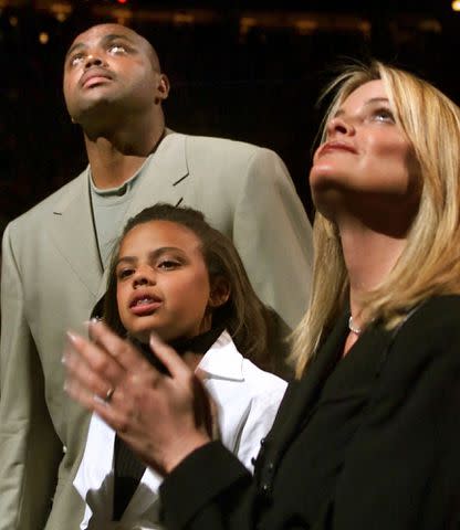 AP Photo Charles Barkley, Christiana Barkley and Maureen Blumhardt watch as his number is retired on March 30, 2001