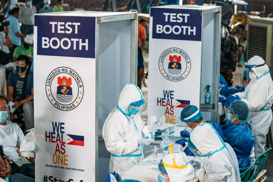 Public transportation drivers queue in Baseco to undergo a free swab test courtesy of the Manila City government on October 6, 2020. (Photo by Mohd Sarajan/NurPhoto via Getty Images)