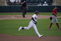 Minnesota Twins' JT Riddle runs to second base during a spring training baseball game int the fourth inning against the Boston Red Sox on Sunday, Feb. 28, 2021, in Fort Myers, Fla. (AP Photo/Brynn Anderson)