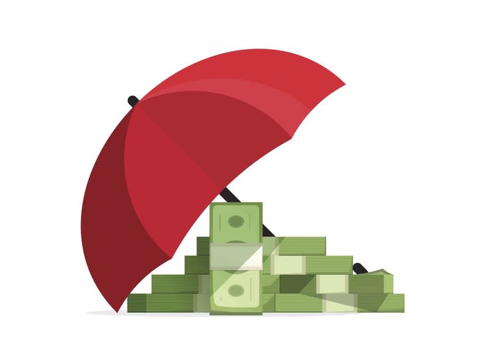 Money under an umbrella depicting insurance
