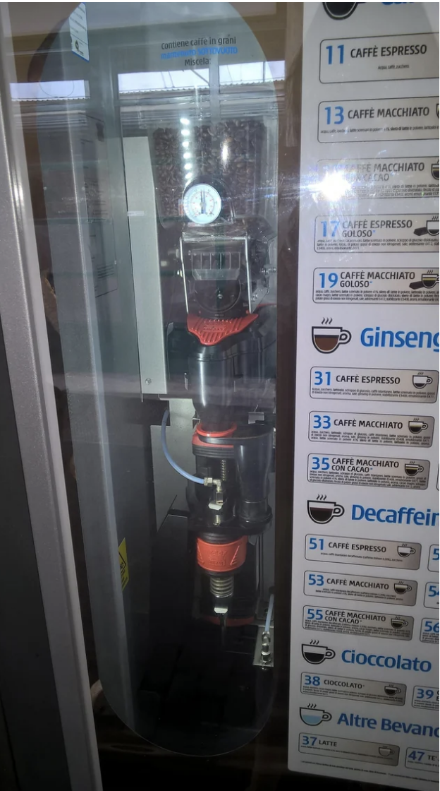 A coffee vending machine with buttons for selecting different beverages,