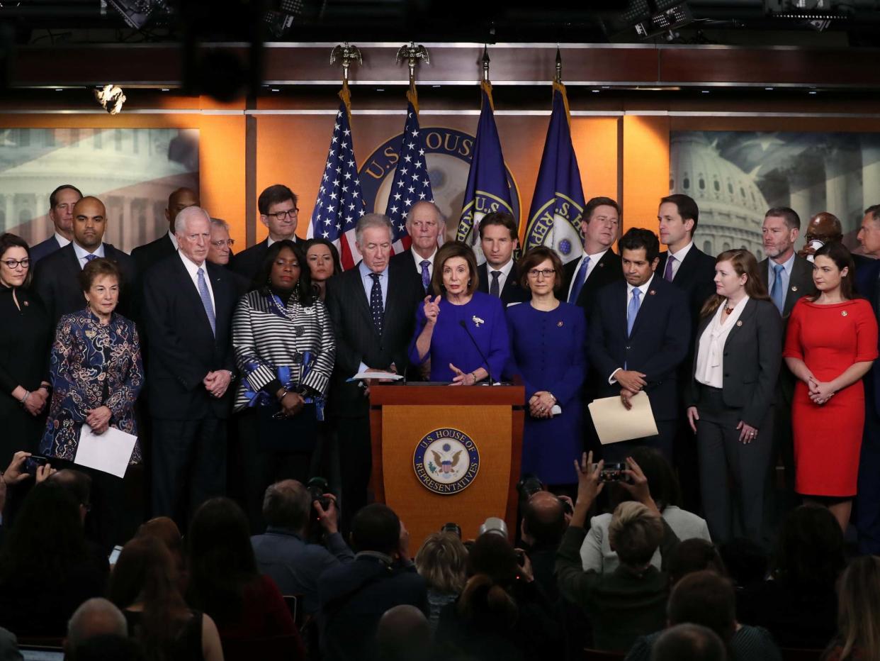 Ms Pelosi announced the deal shortly after Democrats unveiled two articles of impeachment: Getty Images