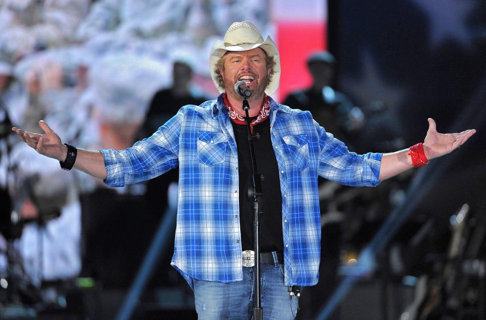 This April 7, 2014, file photo shows Toby Keith as he performs at "ACM Presents an All-Star Salute to the Troops" in Las Vegas.