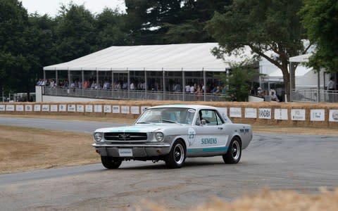 A Siemens converted 1966 Ford Mustang becomes the first autonomous car to drive up the famous Goodwood Hill climb as part of the 25th anniversary of the Festival of Speed in Sussex Friday July 013, 2018. Picture by Christopher Pledger for the Telegraph - Credit: Christopher Pledger