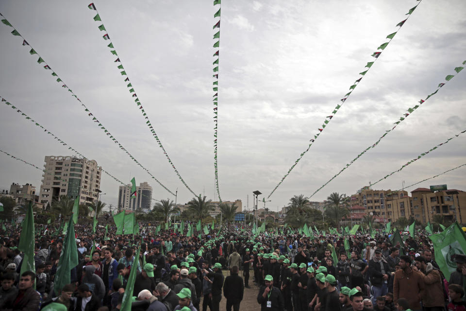 Supporters attend a mass rally marking the 31st anniversary of the founding of Hamas, an Islamic political party, which has an armed wing of the same name, that currently rules in Gaza, Sunday, Dec. 16, 2018, in Gaza city. (AP Photo/Khalil Hamra)