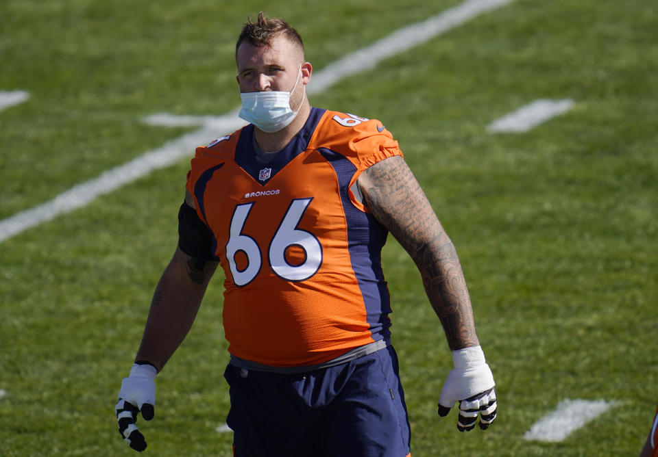 Denver Broncos offensive guard Dalton Risner wears a face covering as he takes part in drills during an NFL football practice Wednesday, Oct. 28, 2020, at the team's headquarters in Englewood, Colo. (AP Photo/David Zalubowski)