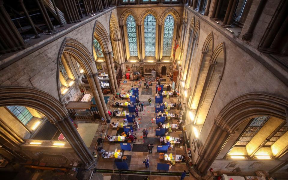 Cubicles erected inside Salisbury Cathedral, Wiltshire, for people to receive an injection of the Pfizer coronavirus vaccine -  Steve Parsons/PA