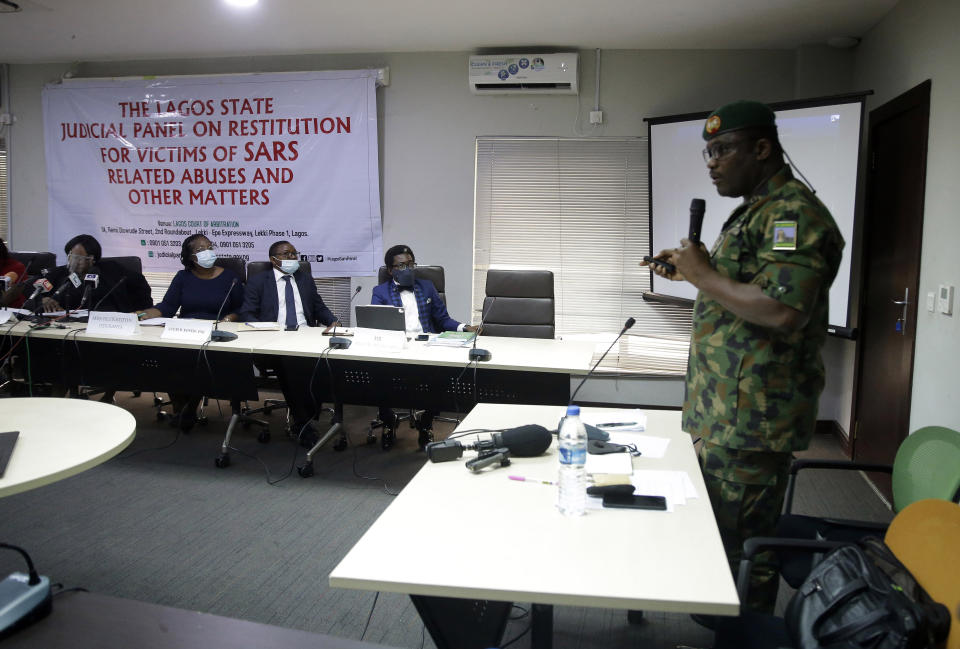 FILE - In this Nov. 14, 2020, file photo, Brig. Gen. Ahmed Taiwo, Commander of the 81 Military Intelligence Brigade, speaks to a judicial committee in Lagos Nigeria. More than 100 Nigerians are awaiting a verdict from a panel that is reviewing both the Lekki shootings and allegations of police brutality that inspired the October 2020 protests. While the police unit at the center of the protests has been disbanded, many Nigerians say police brutality hasn’t stopped. (AP Photo/Sunday Alamba, File)