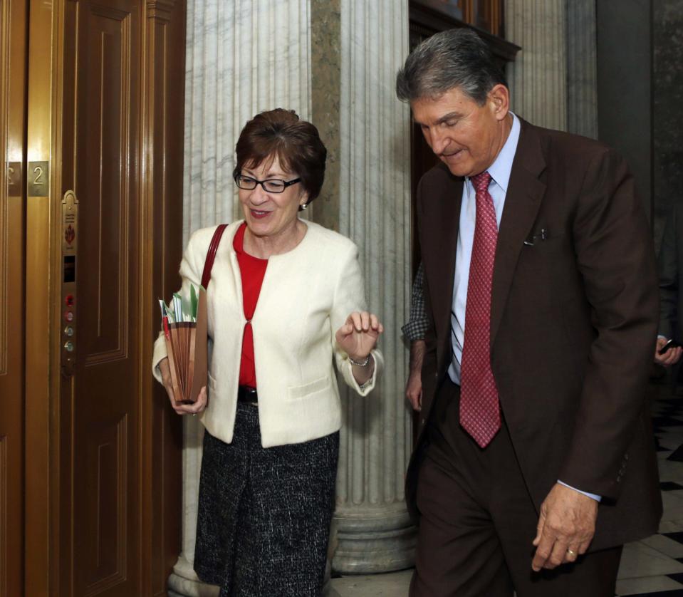 Senators Collins and Manchin walk into Senate chamber for budget vote on Capitol Hill in Washington