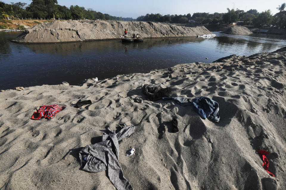 Clothing left behind by Central American migrants who camped out by the Suchiate River cover the riverbank near Ciudad Hidalgo, Mexico, Friday, Jan. 24, 2020. Mexico announced last June that it was deploying the newly formed National Guard to assist in immigration enforcement to avoid tariffs that Trump threatened on Mexican imports. (AP Photo/Marco Ugarte)