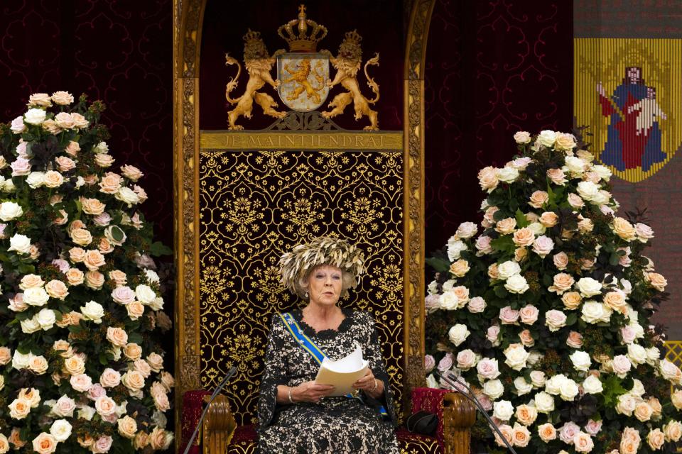 Dutch Queen Beatrix formally opens the new parliamentary year with a speech outlining the government's plans for its 2013 budget, in The Hague, Netherlands, Tuesday, Sept. 18, 2012. The Netherlands' Queen Beatrix underlined her country's commitment to the euro during her annual address to Parliament about the national budget on Tuesday, and made it clear the country will continue to pursue "austerity" policies in response to Europe's debt crisis. (AP Photo/Vincent Jannink)