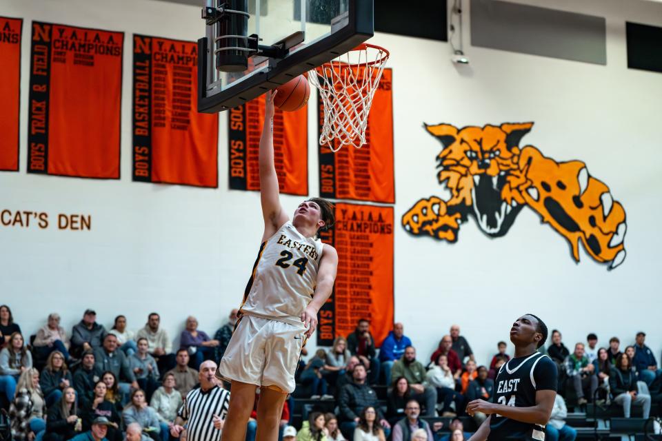 Justin Strausbaugh (24) scores against CD East. Eastern York beat Central Dauphin East, 62-54, during the Northeastern boys' basketball Tip-Off Tournament at Northeastern High School.