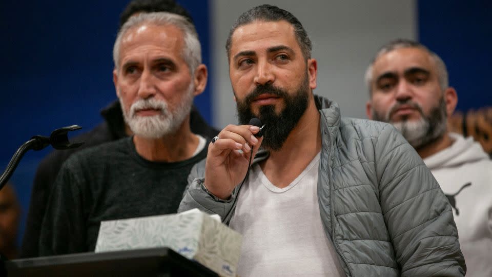 Wadea Al-Fayoume's father speaks at a vigil service at the Prairie Activity & Recreation Center in Plainfield, Illinois, on Tuesday. - Jim Vondruska/Reuters