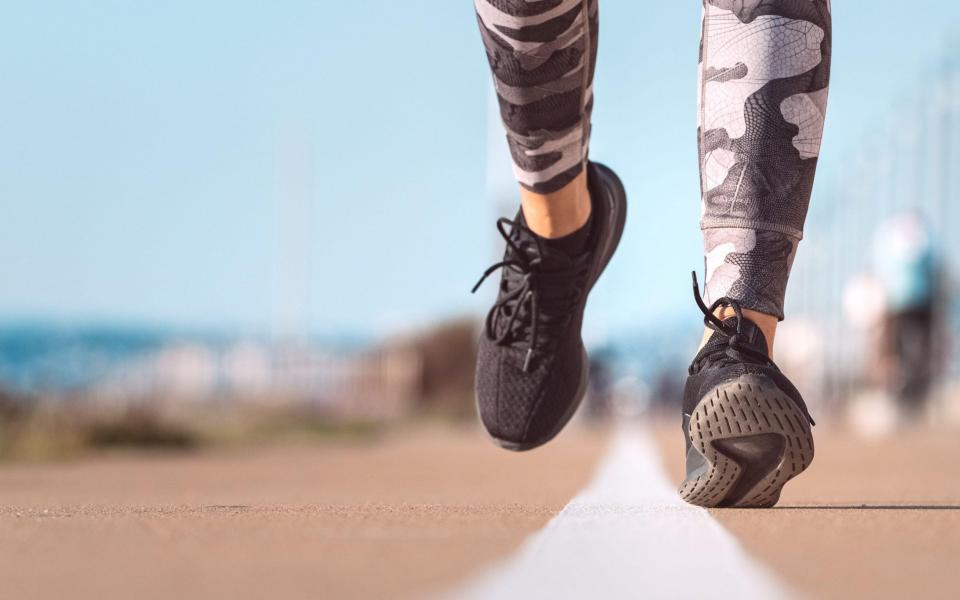 Feet and legs of someone on a run - Alamy Stock Photo