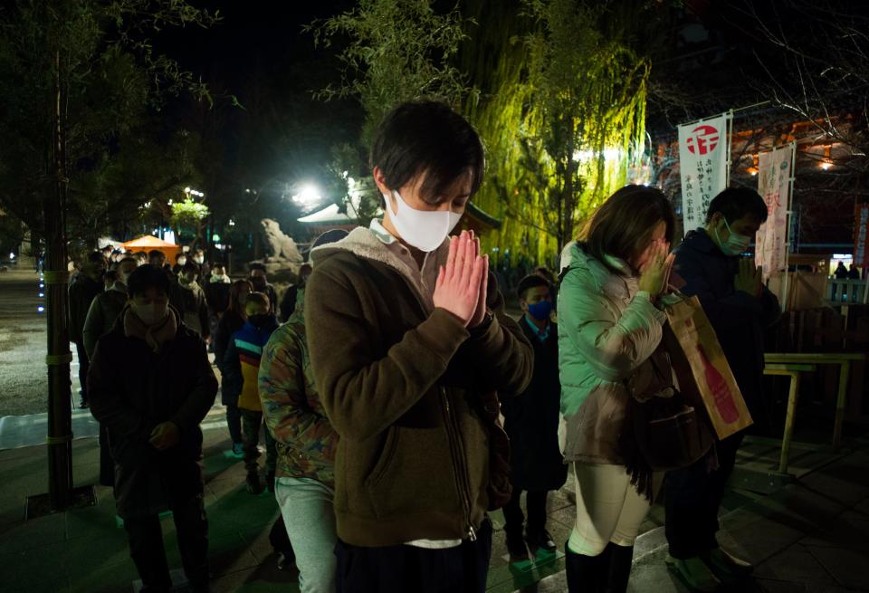 People pray at Asakusa Shrine on New Year's Day in TokyoAP