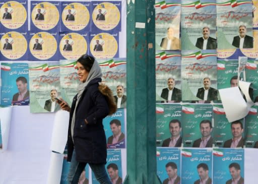 Commentators expect disillusionment among voters in sanctions-hit Iran to result in a low turnout in Friday's parliamentary election despite government appeals for a show of unity