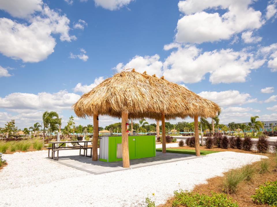 A shaded seating area on a bright blue day.